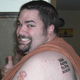 Illustration for article titled Zune Tattoo Guy Legally Changing His Name to Microsoft Zune, is Clearly Insane